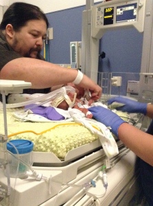 dad changes first micropreemie diaper