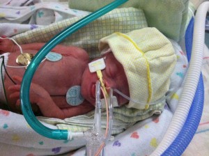 oliver with newborn hat